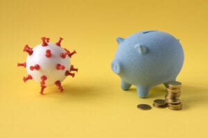 Financial difficulties due to Covid-19. Piggy bank running out of money due to coronavirus.