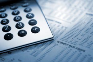 Calculator on paper with interest rates